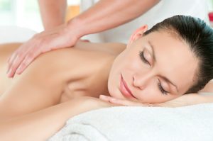 woman receiving a massage body treatment